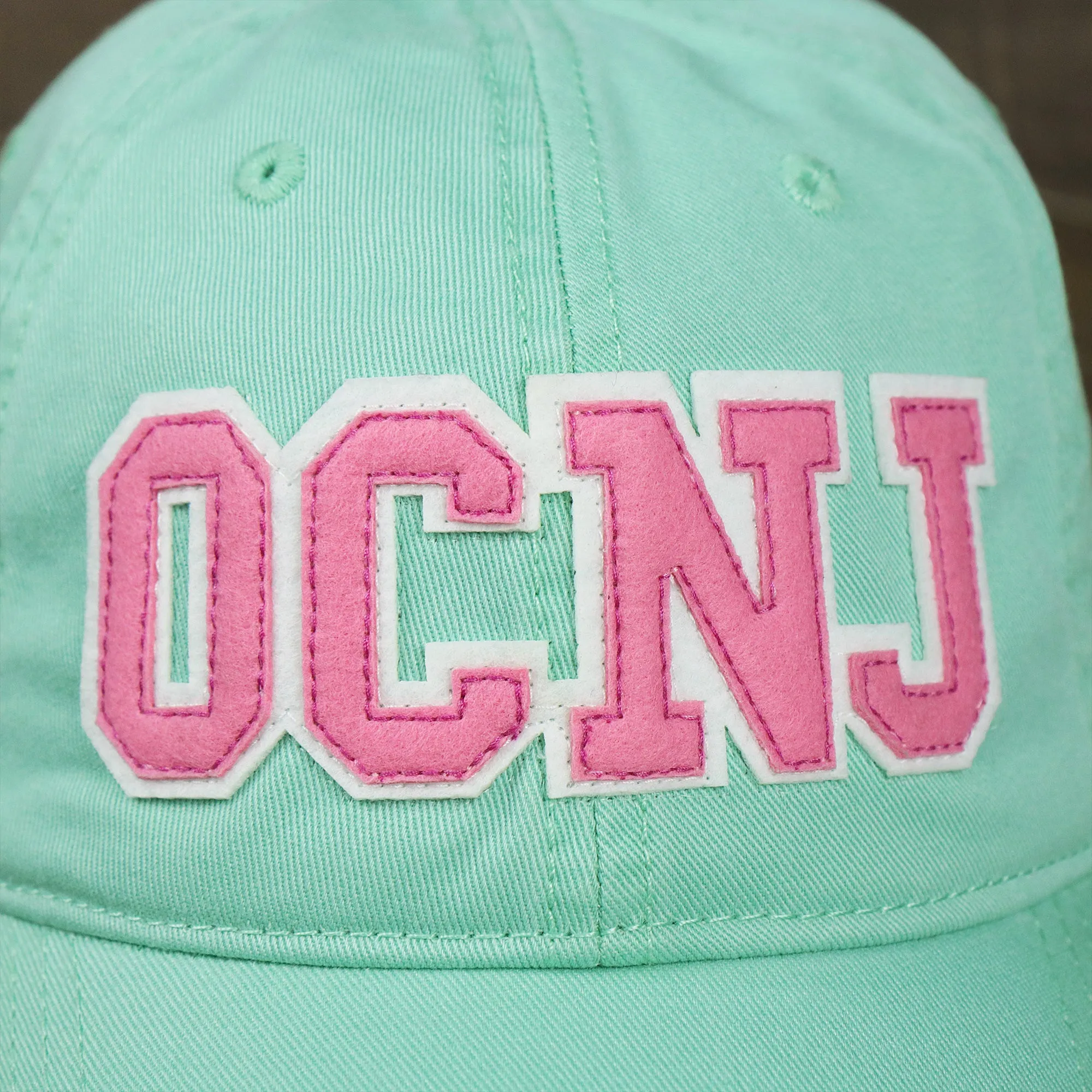 Pink OCNJ Wordmark White Outline Dad Hat | Spearmint Dad Hat